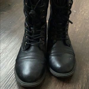 Black combat boots .